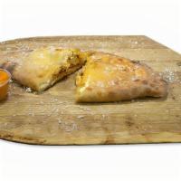 Buffalo Chicken Calzone · Buffalo Chicken Calzone: Oven Roasted Chicken Breast, Our Homemade Buffalo Sauce, Fresh Mozz...