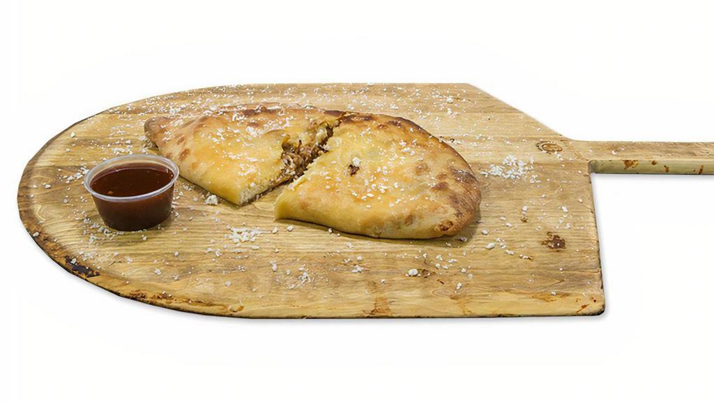 Bbq Pulled Pork Calzone · BBQ Pulled Pork Calzone: Slow Cooked Pork Shoulder in our Pizzeria Every day! Fresh Dough, Our Homemade BBQ Sauce, Fresh Mozzarella Cheese, Bacon, Spices with Ghost Pepper Flakes.