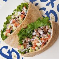 Chicken Gyro Pita · Chicken gyro with lettuce, tomatoes, cucumber, and onions.