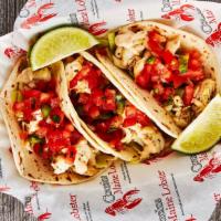 Grilled Fish Tacos (3) · Grilled haddock, served with cabbage, pico de gallo, cilantro lime sauce, on flour tortillas...