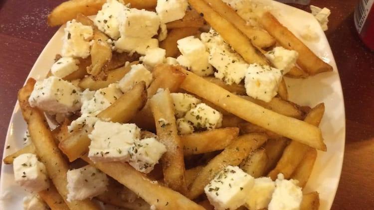 Greek Fries · Deep fried potatoes with seasoned feta cheese and oregano.