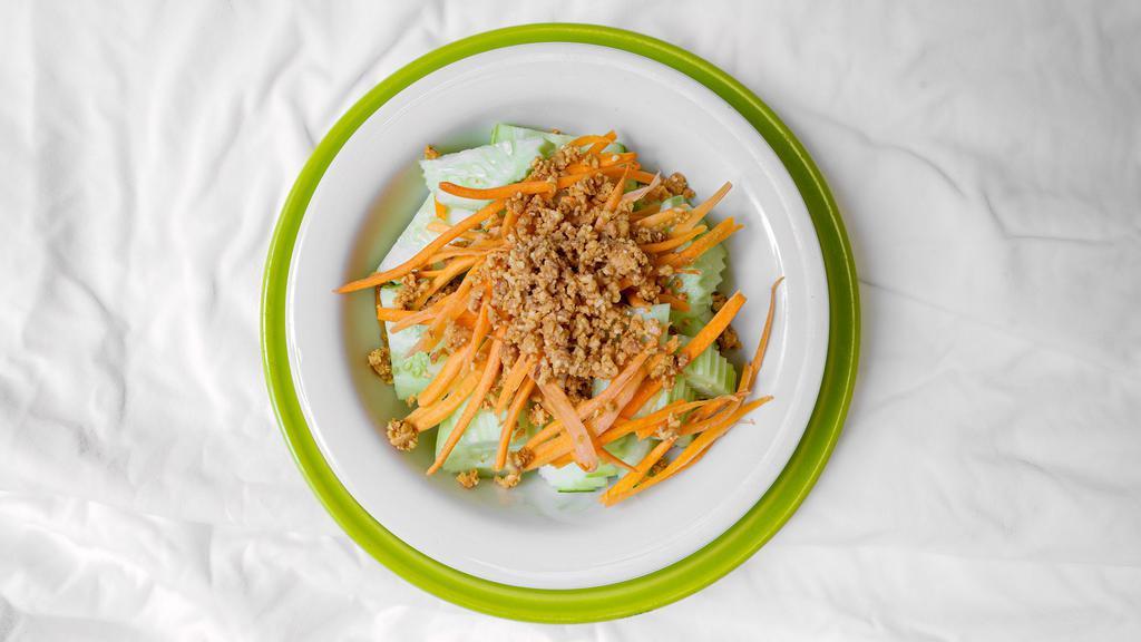 Cucumber Salad · Cucumber, carrot, crushed peanut in rice vinegar dressing to refresh the palate.
