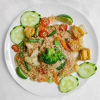 Thai Fried Rice · Khao pad. Fried rice with egg, onion, scallion, tomato and carrot.