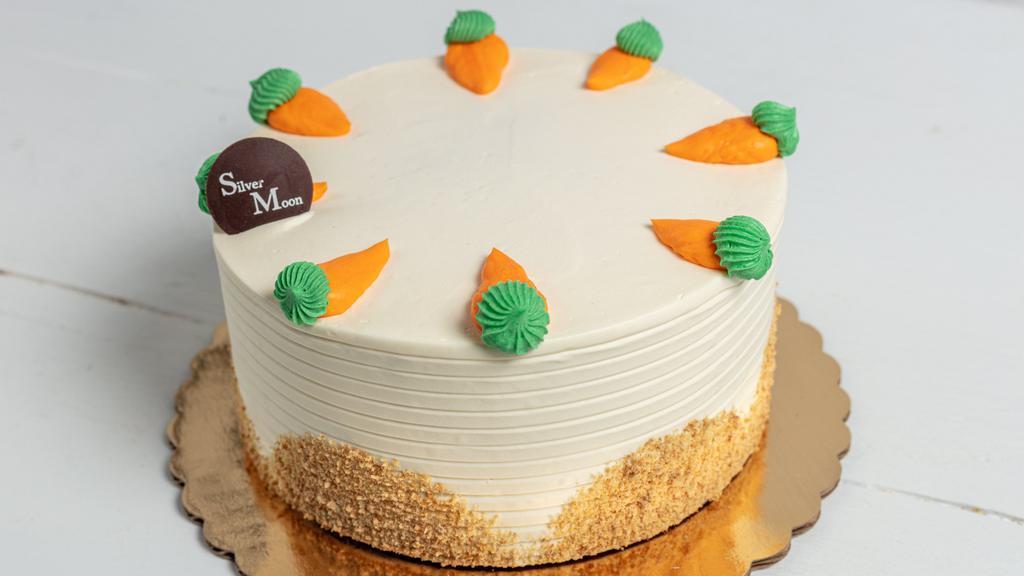 Carrot Cake · A deliciously traditional cake filled with carrots & raisins, moist and rich. 6