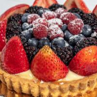 Fresh Berry Tart · A lovely design of delicate mixed berries nestled atop a rich pastry cream filling, surround...