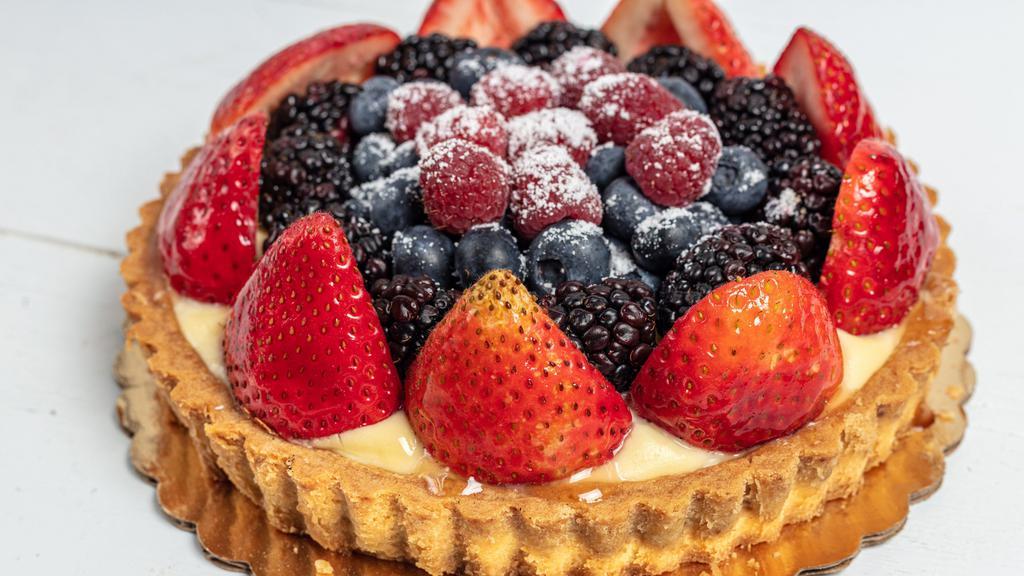 Fresh Berry Tart · A lovely design of delicate mixed berries nestled atop a rich pastry cream filling, surrounded by our signature butter crust.  This signature tart,  one of Silver Moon's most popular,  requires refrigeration.