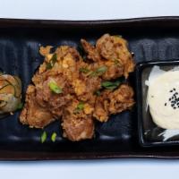 Chicken Karaage · Marinated and double breaded chicken served w/ yuzu ginger aioli and pickles.