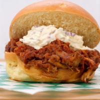 Pulled Pork Sandwich · Slow smoked pulled pork topped with home-style coleslaw.