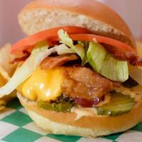Bacon Cheeseburger · Hand pressed, fresh burger topped with American cheese, bacon, lettuce, tomato, pickles, oni...