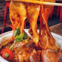Dapan Ji · Hearty Bone in Stewed Chicken with Ribbon or Chopped Ribbon Noodles