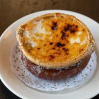 Onion Soup · Classic French onion soup with broiled gruyere, provolone, and parmesan cheeses with crostini
