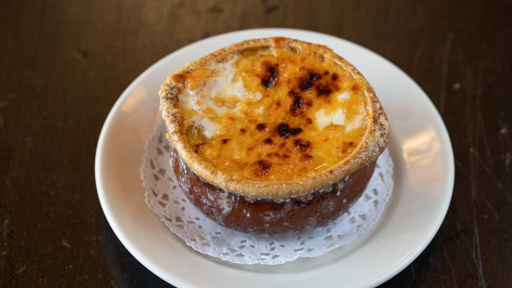 Onion Soup · Classic French onion soup with broiled gruyere, provolone, and parmesan cheeses with crostini