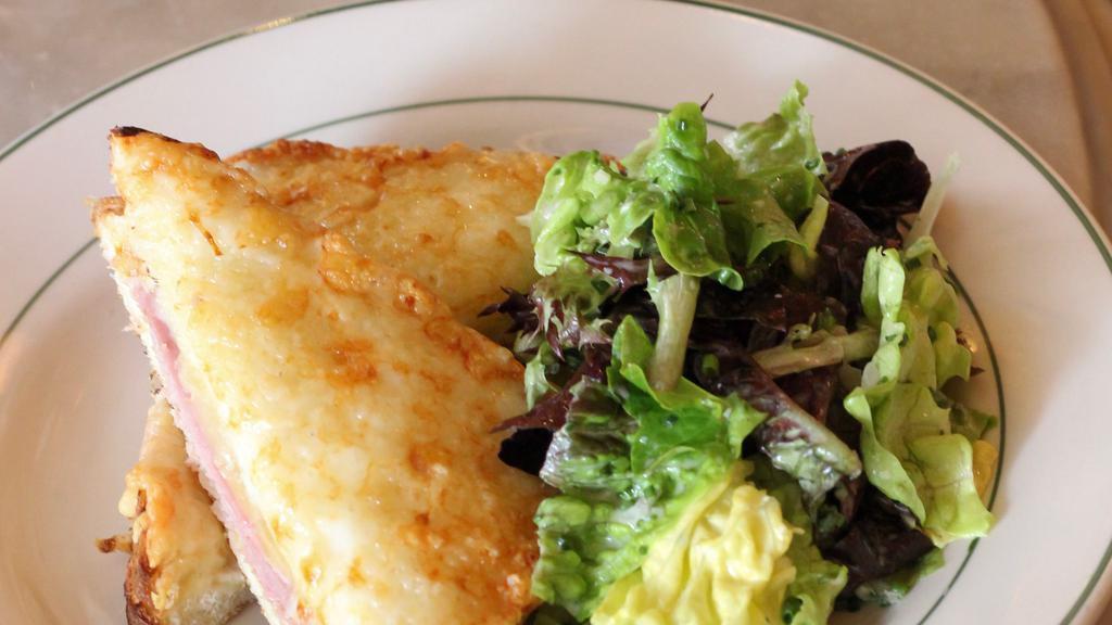 Croque Monsieur · French ham and cheese sandwich with bechamel sauce, and green salad with mustard vinaigrette