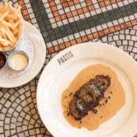 Filet Au Poivre · Pan-roasted filet of beef with pepper, brandy, and cream sauce with frites