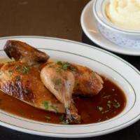 Half Roasted Chicken · Thyme, garlic and sage brined chicken, pomme purée, and chicken jus