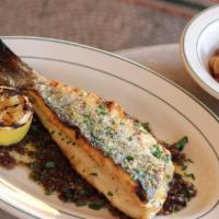 Grilled Branzino · Whole grilled fish, olive tapenade, and gigante white bean salad with roasted red peppers, o...