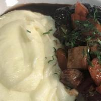Beef Bourguignon · Braised beef shortrib, pommes puree, glazed carrots, bacon, and a red wine sauce