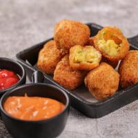 Jalapeño Poppers · Juicy jalapeño poppers breaded and filled with cheese and fried to golden perfection.