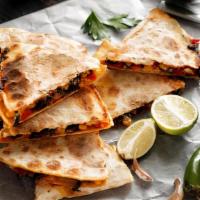 Veggie Quesadilla · Mouthwatering Quesadilla made with fresh Mozzarella cheese, and cheddar cheese. Topped with ...