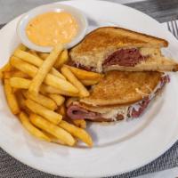 Reuben Sandwich · Corned beef, pastrami or turkey, sauerkraut, melted swiss cheese on toasted rye with russian...