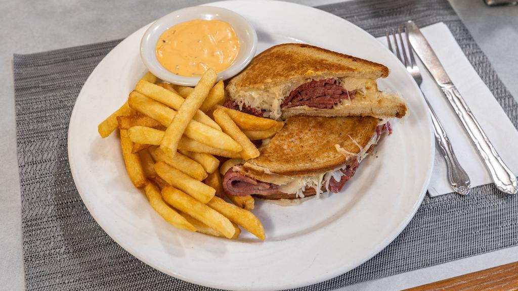 Reuben Burger · Topped with melted Swiss cheese, pastrami, sauerkraut, and Russian dressing.