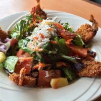 Coconut Shrimp Salad · Mixed greens, tomatoes, pineapple, shredded carrots, toasted coconut and Caribbean mango dre...