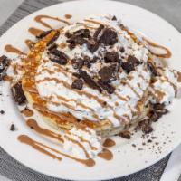Oreo Pancakes · Topped with whipped cream and chocolate sauce. Served with butter and syrup.