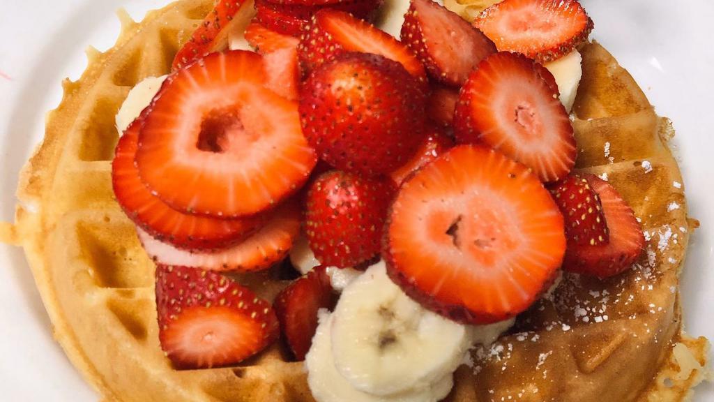 Waffle With Fresh Strawberries · Served with butter and syrup.