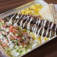 Beef Kafta Platter · Includes yellow rice, pita bread, & signature garlic sauce. Topped with crispy lettuce, cucu...