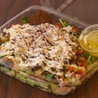 Chicken Shawarma Salad · Flavorful, fresh greens that include: baby spinach, Romaine lettuce, tossed with our famous ...