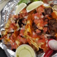 Cheesy Shell Tacos · Steak / chicken / al pastor melted cheese on tortilla with pico