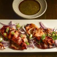 Thai Grilled Squids With Green Sauce · Fresh squids marinated and slowly grilled in charcoal, served with a spicy cilantro-lime sau...