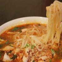 Tom Yum Soup · Spicy. Spicy Thai herbal soup with roasted chili paste, lime, and mushrooms with choice of p...