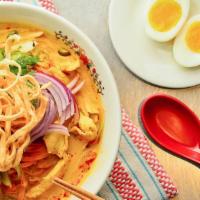 Chiang Mai Curry Noodle Soup · Gluten-free rice noodle in a mild yellow curry sauce with pickled cabbage, shallots and scal...