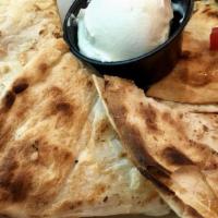 Chicken  Quesadillas · Cheddar and Monterey jack cheese, peppers, onions, tomato, grilled in a flour tortilla. Serv...