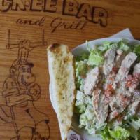 Chicken Caesar Salad · Grilled marinated chicken, tossed with tender romaine lettuce, Parmesan cheese, diced tomato...
