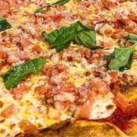 Bruschetta Pizza · Fresh plum tomato sauce with fresh mozzarella topped with freshly chopped tomatoes, red onio...