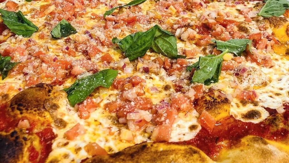 Bruschetta Pizza · Fresh plum tomato sauce with fresh mozzarella topped with freshly chopped tomatoes, red onions and fresh basil.