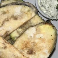 Anassa Chips · Thinly sliced zucchini and eggplant, lightly fried served with tzatziki.