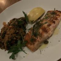 Organic Salmon · Grilled, extra virgin olive oil and lemon, capers, served with spinach and rice.