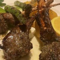 Lamb Chops · Three racks of lamb served with roasted lemon potatoes and grilled asparagus.
