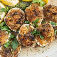 Baked Clams · Fresh clams baked and topped with blend of herbs, garlic, parmesan cheese and toasted breadc...