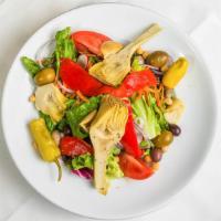 Italian Salad · Greens, pepperoncini, olives, roasted peppers, artichoke hearts, cucumber, chickpeas, mushro...