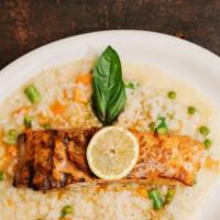 Grilled Salmon · Served over risotto and topped with a white wine, lemon and butter sauce