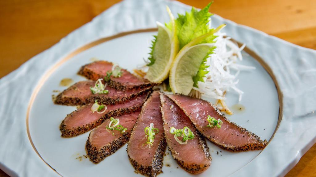 Tuna Tataki · Six pieces. Thinly sliced seared black peppercorn encrusted tuna.