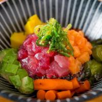 Poke Bowl · Cube seasoned tuna and salmon, with assortment Japanese pickles and avocado,  over sushi rice.