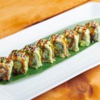 Dragon Roll · Broiled Eel and cucumber inside topped with thinly slices avocado.