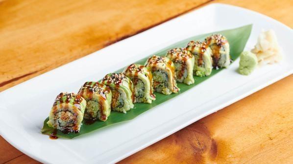 Dragon Roll · Broiled Eel and cucumber inside topped with thinly slices avocado.