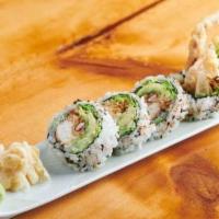 Spider Roll · Soft-shell crab tempura with avocado and cucumber inside topped with masago.