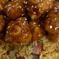 Sesame Chicken芝麻鸡C · Served with white, fried, pork, veggie, chicken, beef or shrimp rice and egg roll or soda.
